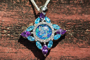 starburst cremation jewelry with zircons on wood